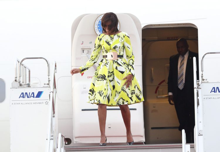 Looking like a stunning modern jet-setter Michelle Obama (wearing Kenzo) arrives  at Haneda International airport, Tokyo, Japan. (Rex Features)